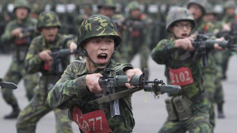 FILE - New recruits practice thrusting with their bayonets at a military training center in Hsinchu County, northern Taiwan on April 22, 2013. Taiwan will extend its compulsory military service from four months to a year starting in 2024, President Tsai Ing-wen said Tuesday, Dec. 27, 2022, as the self-ruled island faces China's military, diplomatic and trade pressure. (AP Photo/Chiang Ying-ying, File)