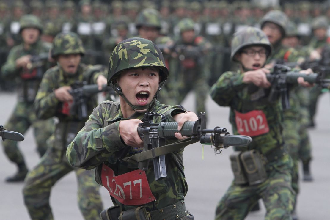 New recruits practice with bayonets at a military training center in Hsinchu County, northern Taiwan on April 22, 2013. 