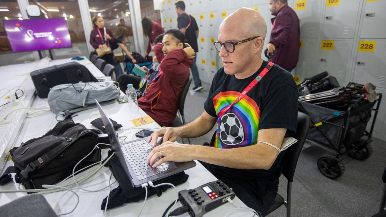 Wahl works in the media center before the Wales vs. US game at the 2022 World Cup.
