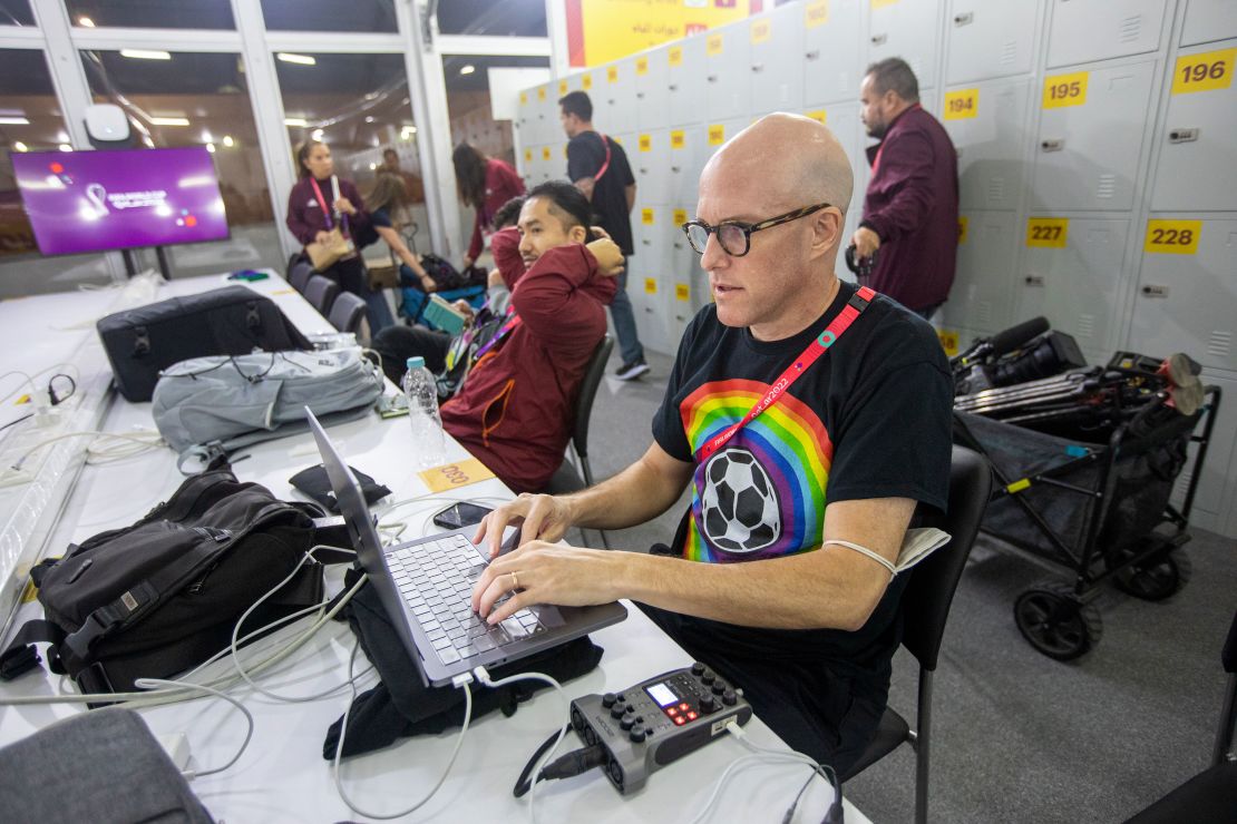 Wahl works in the media center before the Wales vs. US game at the 2022 World Cup.