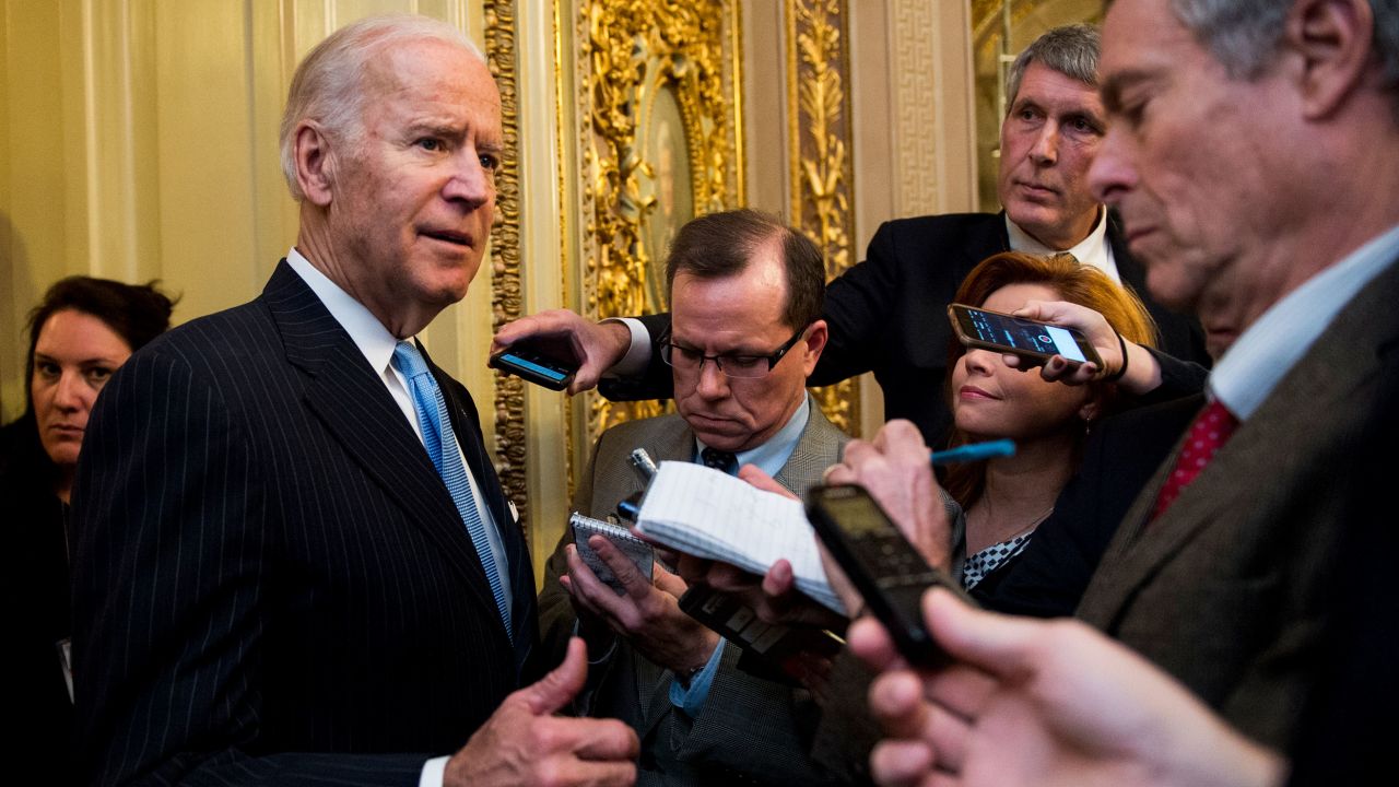 Then-Vice President Joe Biden stops to speak with reporters in the Senate Reception Room following the cloture vote on the "21st Century Cures Act" in the Capitol on Dec. 5, 2016.