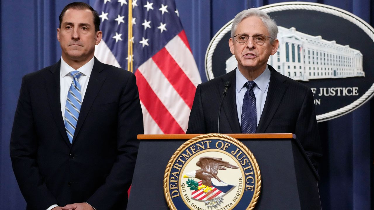 Attorney General Merrick Garland speaks during a news conference at the Department of Justice, Thursday, Jan. 12, 2023, in Washington, as John Lausch, the U.S. Attorney in Chicago, looks on.