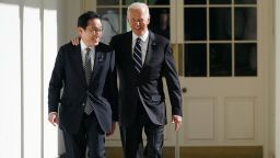 TOPSHOT - US President Joe Biden and Japanese Prime Minister Fumio Kishida walk through the colonnade of the White House in Washington, DC, on their way to the Oval Office on January 13, 2023.