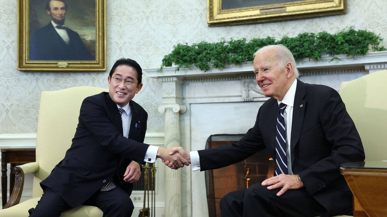 US President Joe Biden and Japanese Prime Minister Fumio Kishida shake hands during a meeting in the Oval Office at the White House in Washington, DC, on January 13, 2023.