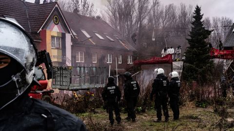 Police prepare to enter buildings to remove activists in the condemned village of Lützerath on Thursday, January 12.  Germany plans to destroy this village for a coal mine. Thousands are gathering to stop it 230113124010 02 lutzerath germany coal mine climate intl restricted