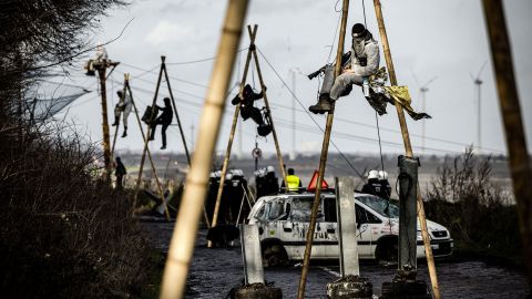German police work to remove activists from the posts in the occupied village of Lützerath.