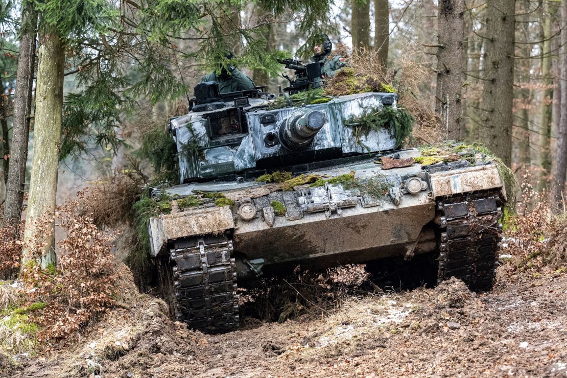 A Polish Leopard 2 stands in a wooded area during the international military exercise "Allied Spirit 2022" at the Hohenfels military training area in Bavaria, Hohenfels, January 27 2022.
