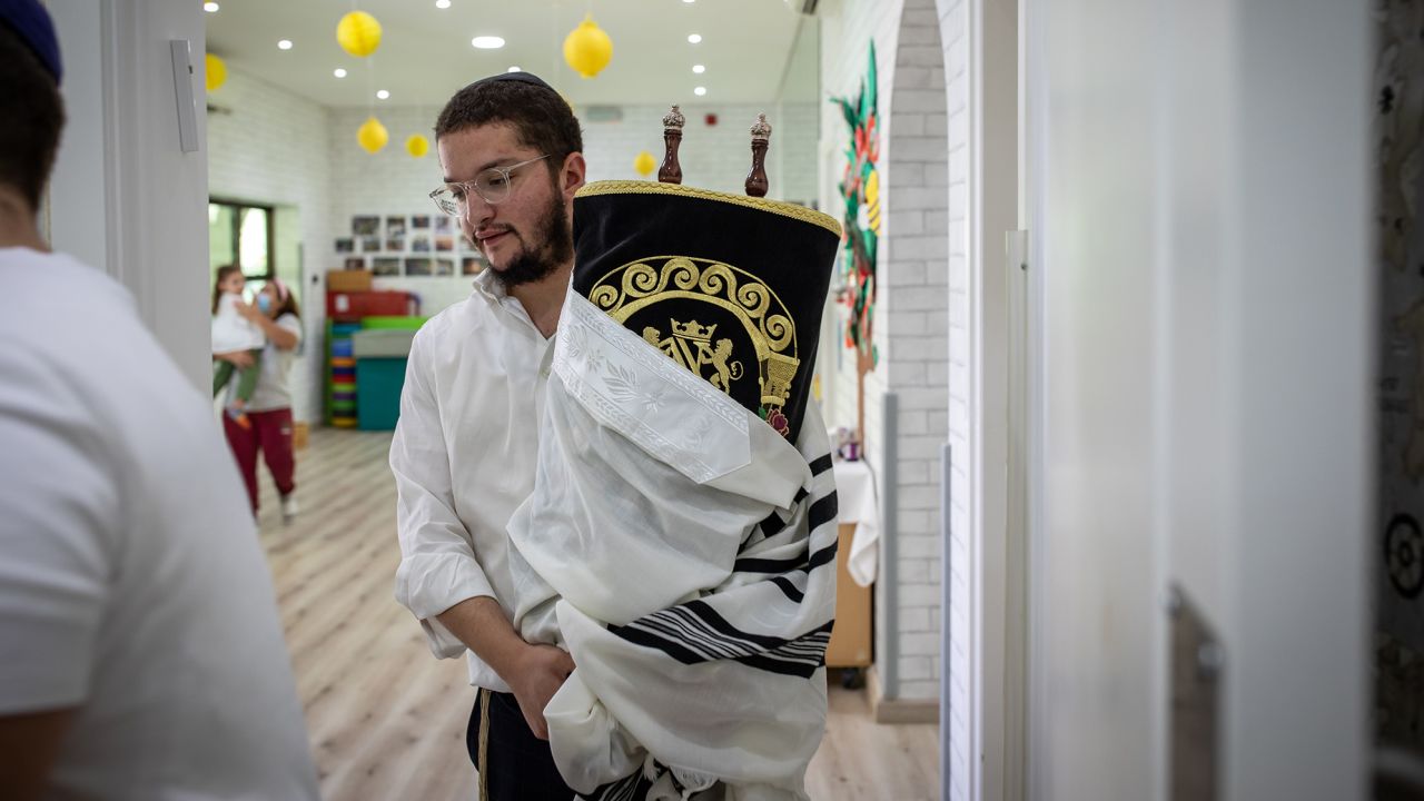 Student rabbis carry in a Torah for a demonstration during lessons at the Jewish Hebrew School on October 8, 2021 in Dubai, United Arab Emirates. 