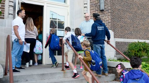 Students enter Central Elementary School in Petoskey, Michigan, for the first day of the 2022-23 school year.