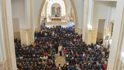 Worshipers attend a mass inside the Church of the Baptism of Lord Jesus Christ in Jordan Valley, Jordan, during an annual Christian pilgrimage on January 13.