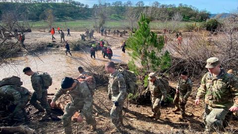 National Guard troops, sheriff's office personnel and firefighters search for missing 5-year-old Kyle Doan Thursday near San Miguel, California.