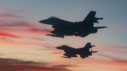 F-16 Fighting Falcons from Eglin Air Force Base fly over a high school football game in Niceville, Fla., Sept. 24, 2021.  The Okaloosa County Schools held a Prisoner of War/Missing In Action remembrance ceremony prior to kick-off.  