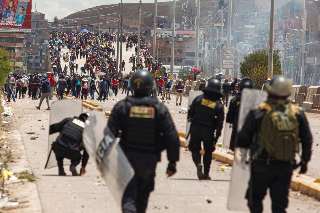 Supporters of ousted president Pedro Castillo clash with police forces in the Peruvian Andean city of Juliaca on January 7, 2023. 
