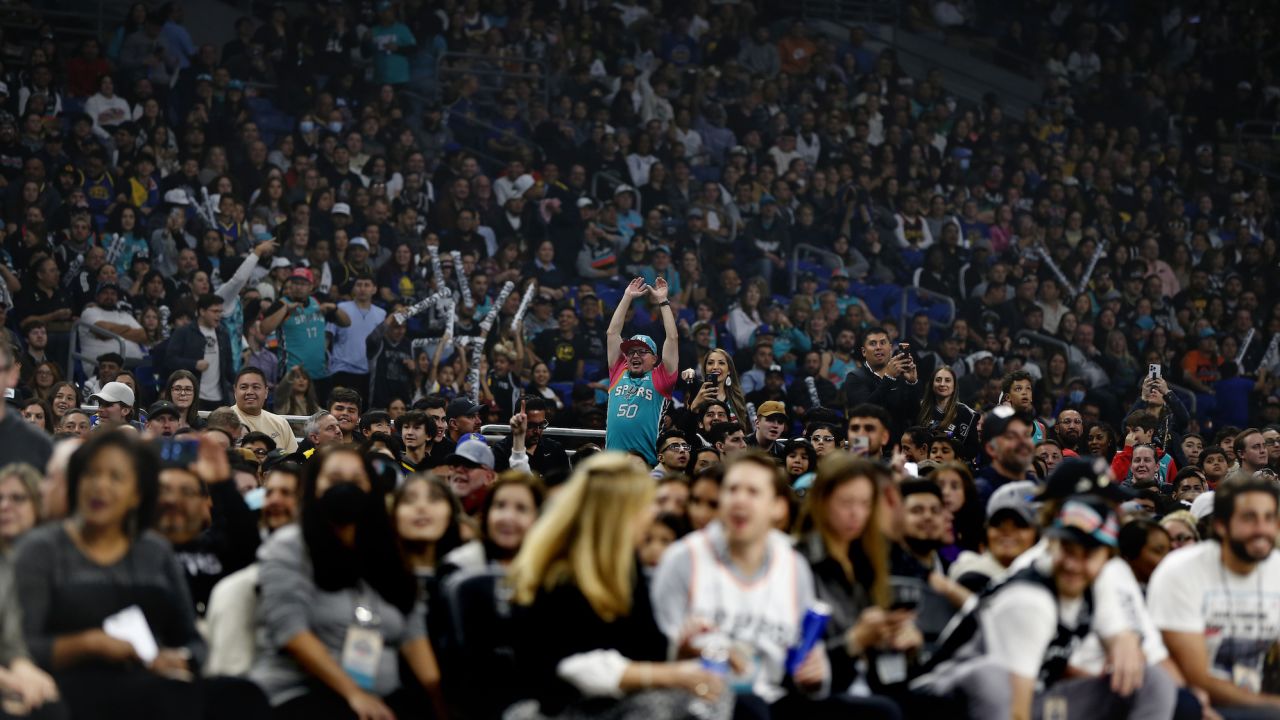 San Antonio fans cheer on their team against the Golden State Warriors in the second half at Alamodome. 