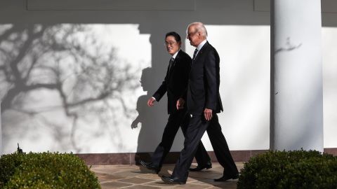 US President Joe Biden and Japanese Prime Minister Fumio Kishida walk to the Oval Office for a meeting at the White House on January 13.