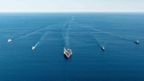 Japanese and South Korean warships join the submarine USS Annapolis and US nuclear-powered aircraft carrier Ronald Reagan during a combined trilateral anti-submarine exercise on September 30, 2022.