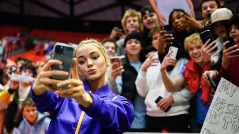 SALT LAKE CITY, UTAH - JANUARY 06: Olivia Dunne of LSU takes a 'selfie' with fans after a PAC-12 meet against Utah at Jon M. Huntsman Center on January 06, 2023 in Salt Lake City, Utah. (Photo by Alex Goodlett/Getty Images)