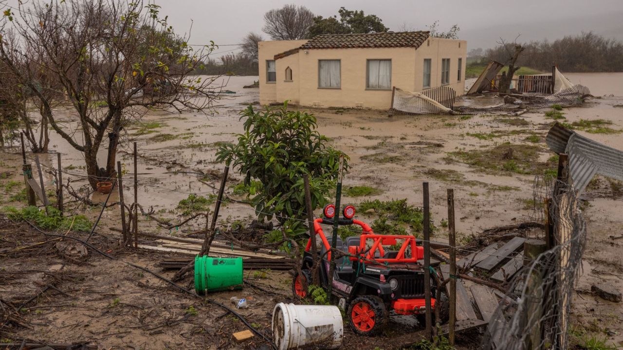 Flood waters inundate a home by the Salinas River near Chualar, California, Saturday.