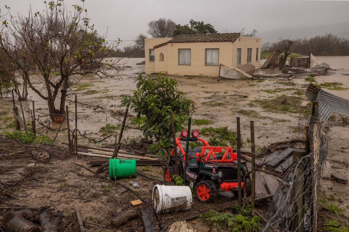 Flood waters inundate a home by the Salinas River near Chualar, California, Saturday.