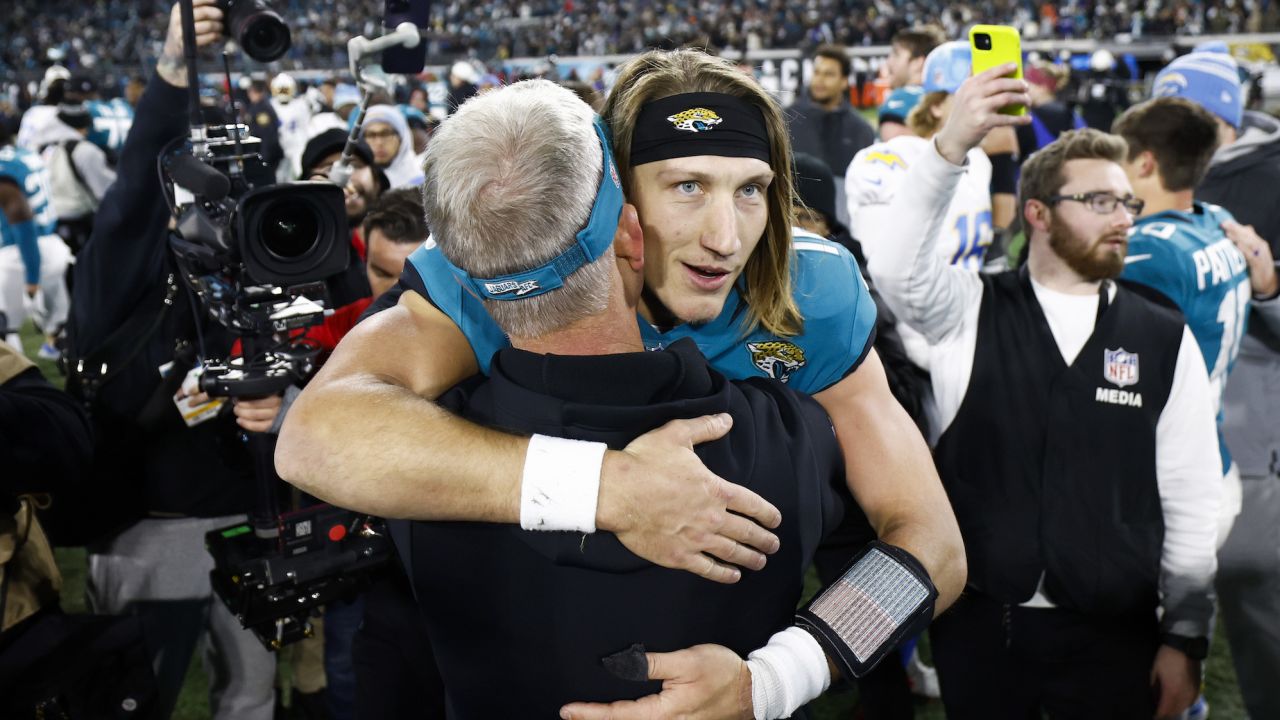 Trevor Lawrence celebrates on the field after the Jaguars defeated the Los Angeles Chargers 31-30 in the AFC Wild Card playoff game at TIAA Bank Field Saturday in Jacksonville, Florida.