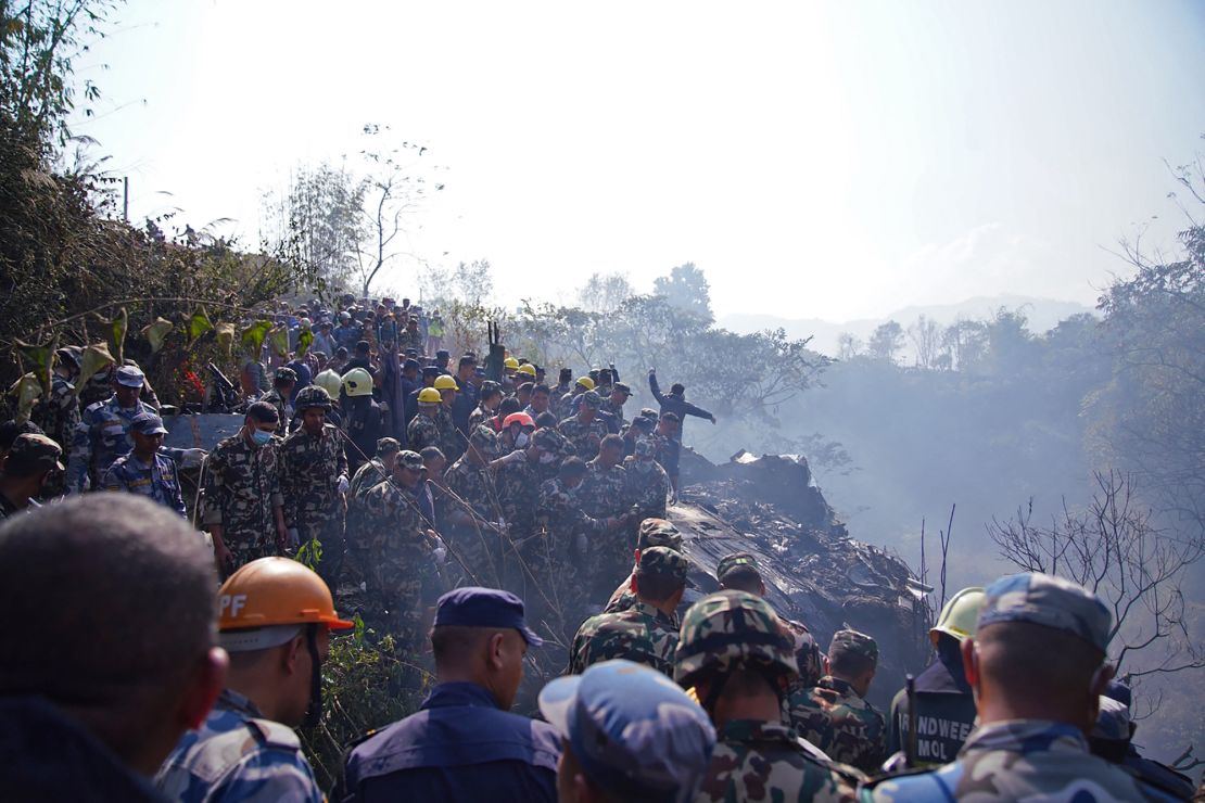 Rescuers gather at the site of the plane crash in Pokhara on January 15, 2023.
