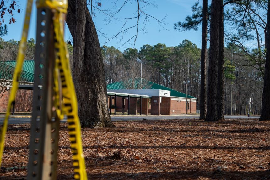 NEWPORT NEWS, VA - JANUARY 07: Police tape hangs from a sign post outside Richneck Elementary School following a shooting on January 7, 2023 in Newport News, Virginia. A 6-year-old student was taken into custody after reportedly shooting a teacher during an altercation in a classroom at Richneck Elementary School on Friday. The teacher, a woman in her 30s, suffered "life-threatening" injuries and remains in critical condition, according to police reports. (Photo by Jay Paul/Getty Images)