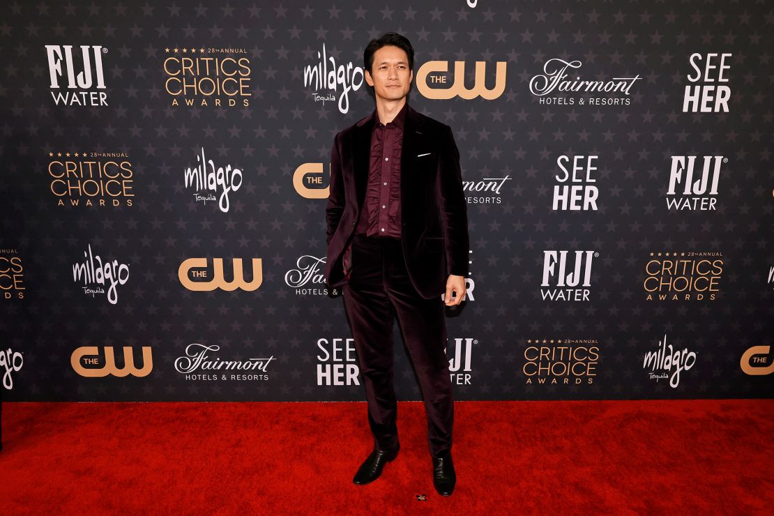 Harry Shum Jr., part of the "Everything Everywhere All at Once" cast nominated for Best Acting Ensemble, arrived in a dark velvet suit. 