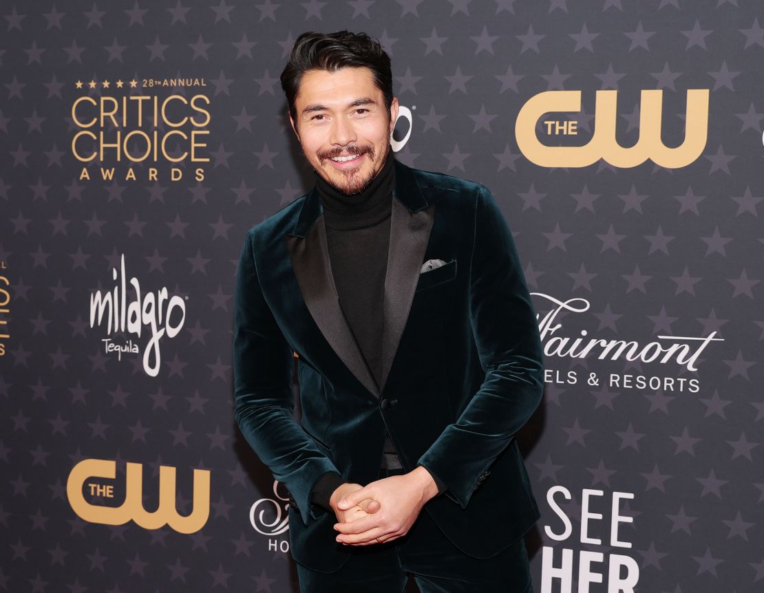 Henry Golding looked suave in a dark velvet suit. 