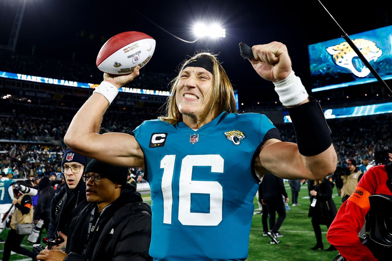 Jacksonville Jaguars quarterback Trevor Lawrence celebrates on the field after completing a massive comeback against the Los Angeles Chargers. Lawrence threw four interceptions -- and also four touchdowns -- as he led the Jaguars back from 27-0 down in the first half to beat the Chargers 31-30 thanks to a last-second field goal.  