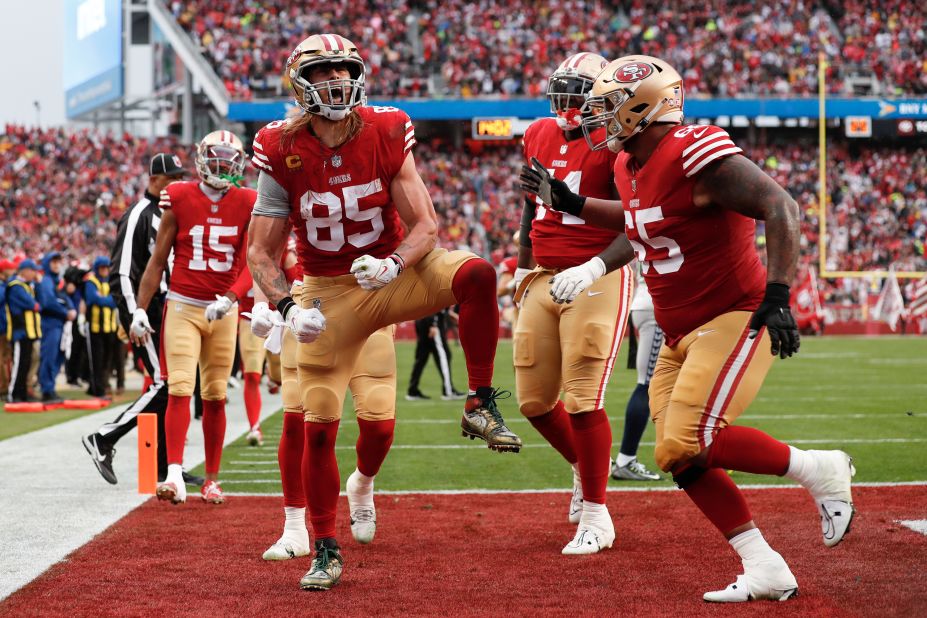 San Francisco 49ers tight end George Kittle celebrates after scoring a two-point conversion against the Seattle Seahawks. The 49ers used a big second half to break away from a plucky Seahawks squad and win 41-23. It continues the remarkable run of rookie 49ers quarterback Brock Purdy -- who threw for three touchdowns -- who was drafted with the final pick of last year's NFL draft. 