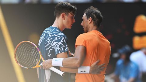 Nadal and Draper kiss at the net after the Spaniards win. 