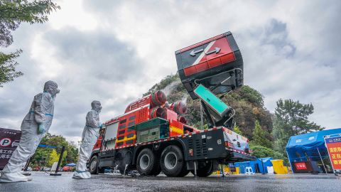 Firefighters disinfect a street in Bijie, Guizhou Province, China, Sept 18, 2022. 