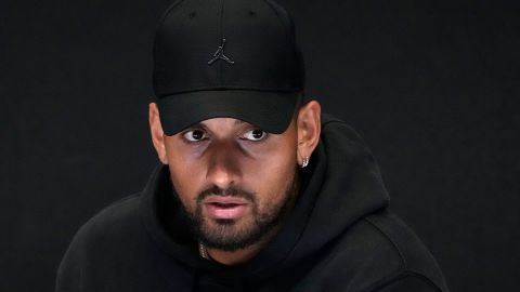 Australia's Nick Kyrgios reacts as he announces his withdrawal from the Australian Open with a knee injury at a press conference in Melbourne, Australia, Monday, January 16, 2023. 