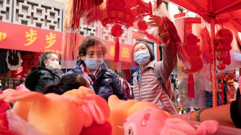 People shop at a fair held for the upcoming Chinese Lunar New Year on January 14 in Chinatown, San Francisco's Chinatown.