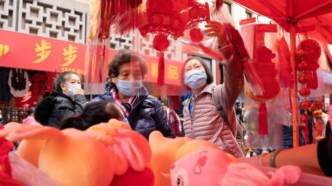 People shop at a fair held for the upcoming Chinese Lunar New Year on January 14 in Chinatown in San Francisco's Chinatown.