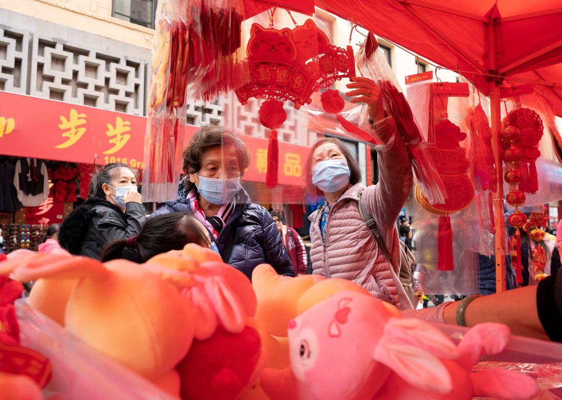 People shop at a fair held for the upcoming Chinese Lunar New Year on January 14 in Chinatown in San Francisco's Chinatown.