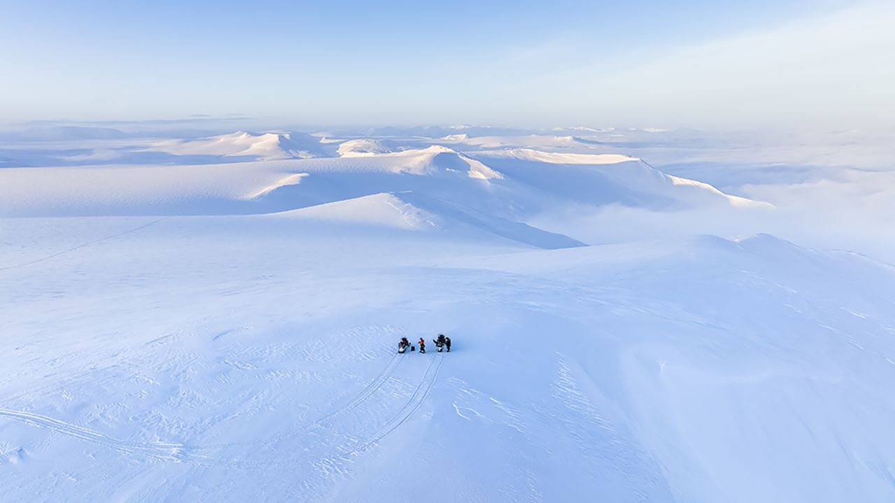 Ledoux is attracted by the immense and endless Arctic landscape.  Here, he and a colleague are pictured on snowmobiles on the east coast of Svalbard during winter.