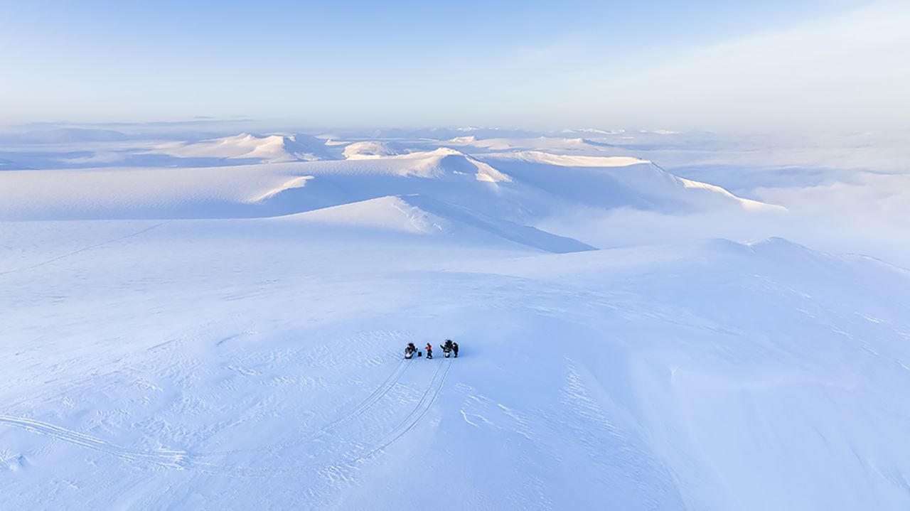Ledoux is attracted by the immense and endless Arctic landscape. Here, he and a colleague are pictured on snowmobiles on the east coast of Svalbard during winter.