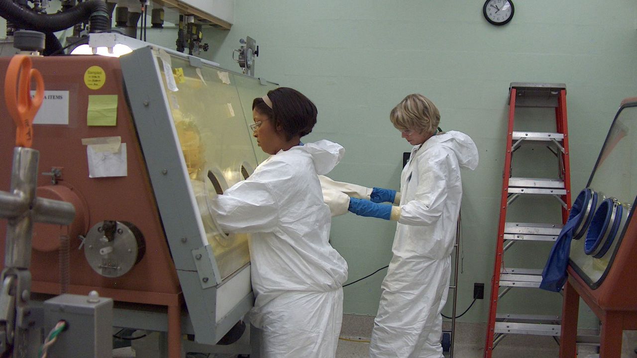 Clarice Phelps works in 2012 to purify the element berkelium as fellow scientist Shelley VanCleve observes at Oak Ridge National Lab in Tennessee.