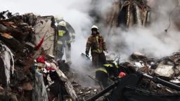 DNIPRO, UKRAINE - JANUARY 15: Emergency workers search the remains of a residential building that was struck by a Russian missile yesterday on January 15, 2023 in Dnipro, Ukraine. At least 20 people were reported dead after a missile hit the apartment building on Saturday, part of fresh wave of missiles launched by Russia. The Ukrainian president said his forces shot down 20 of 30 missiles fired by Russia on Saturday. (Photo by Spencer Platt/Getty Images)