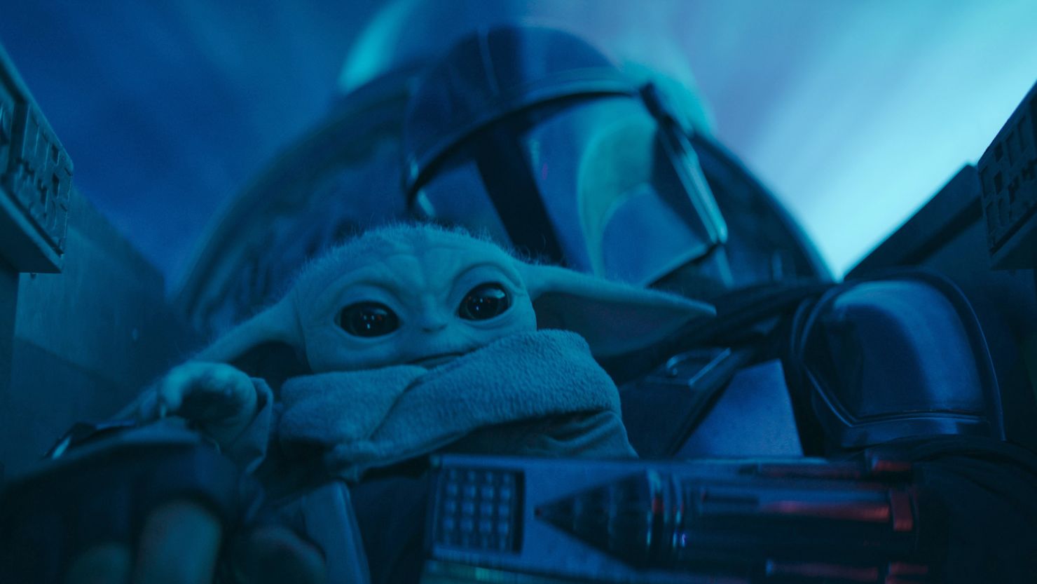 Grogu and Din Djarin (voiced by Pedro Pascal) in "The Mandalorian."