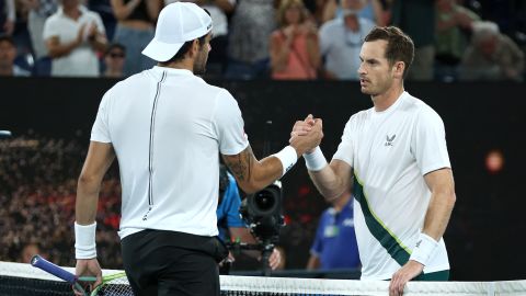 Murray shakes hands with Berrettini after winning their first round singles match.