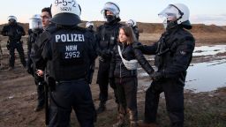 Police officers detain climate activist Greta Thunberg on the day of a protest against the expansion of the Garzweiler open-cast lignite mine of Germany's utility RWE to Luetzerath, in Germany, January 17, 2023 that has highlighted tensions over Germany's climate policy during an energy crisis. REUTERS/Wolfgang Rattay      TPX IMAGES OF THE DAY     