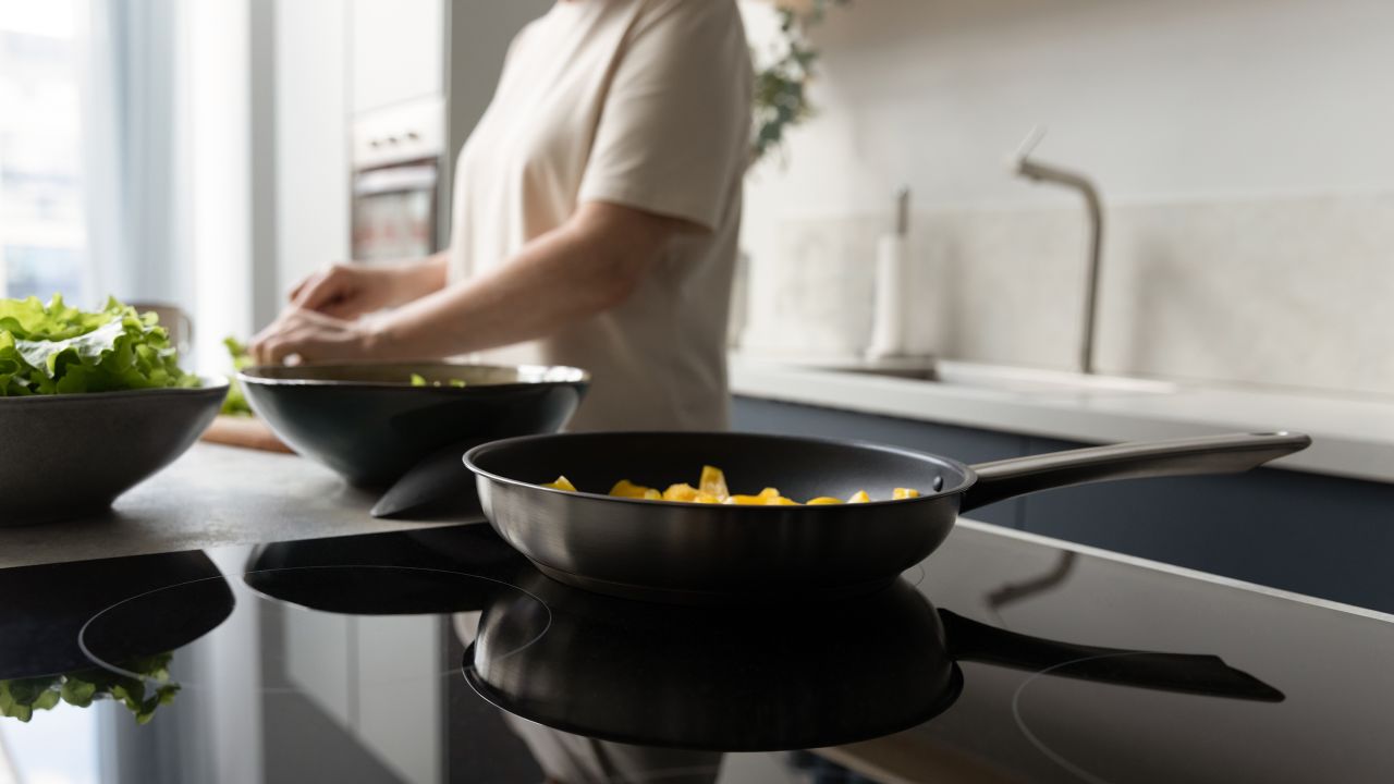 Induction stoves use electricity to create a magnetic field and generate heat right in the cookware instead of on the surface of the stovetop.