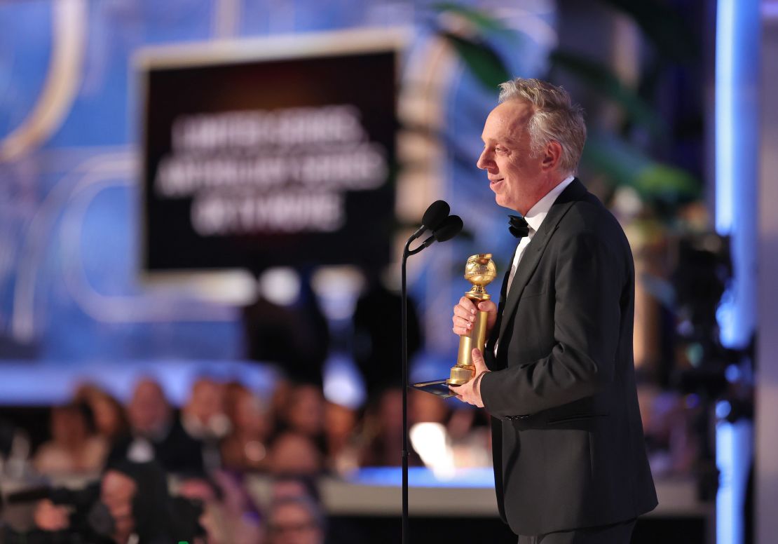 Mike White accepts the best limited or anthology series or television film award for "The White Lotus" at the Golden Globe Awards.