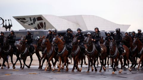 Security forces mounted on horses stand guard outside the Planalto Palace, in Brasilia on January 11 for a protest that failed to materialize.   Brazil security failings on January 8 draw growing scrutiny 230117130356 02 brazil police bolsonaro congress attack intl latam