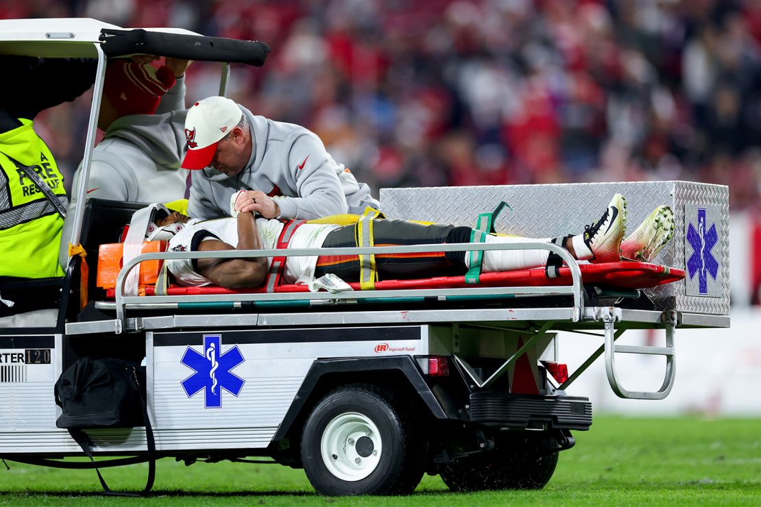 Russell Gage of the Tampa Bay Buccaneers is carted off the field after suffering a concussion against the Dallas Cowboys in the NFC Wild Card playoff game at Raymond James Stadium on January 16, 2023 in Tampa. 