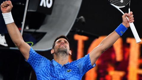 Novak Djokovic celebrates after winning against Roberto Carballés Baena in the opening round of the Australian Open.