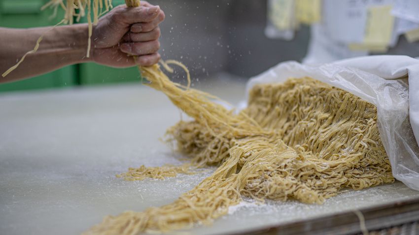 A worker prepares noodles at the Aberdeen Yau Kee noodle factory in Hong Kong on January 13, 2023. Credit: Noemi Cassanelli/CNN