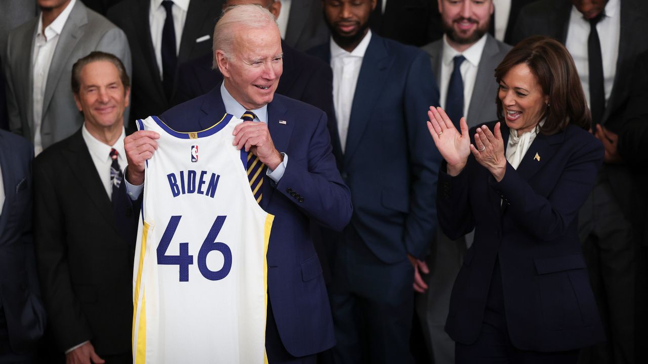 WASHINGTON, DC - JANUARY 17: U.S. President Joe Biden holds up a Golden State Warriors jersey bearing #46 as Vice President Kamala Harris (R) applauds on January 17, 2023 in Washington, DC. The Warriors won the 2022 NBA Championship.
